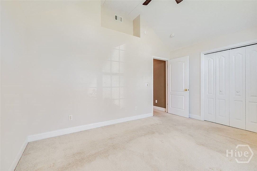 Bedroom with vaulted ceiling at 641 Marshview Dr.