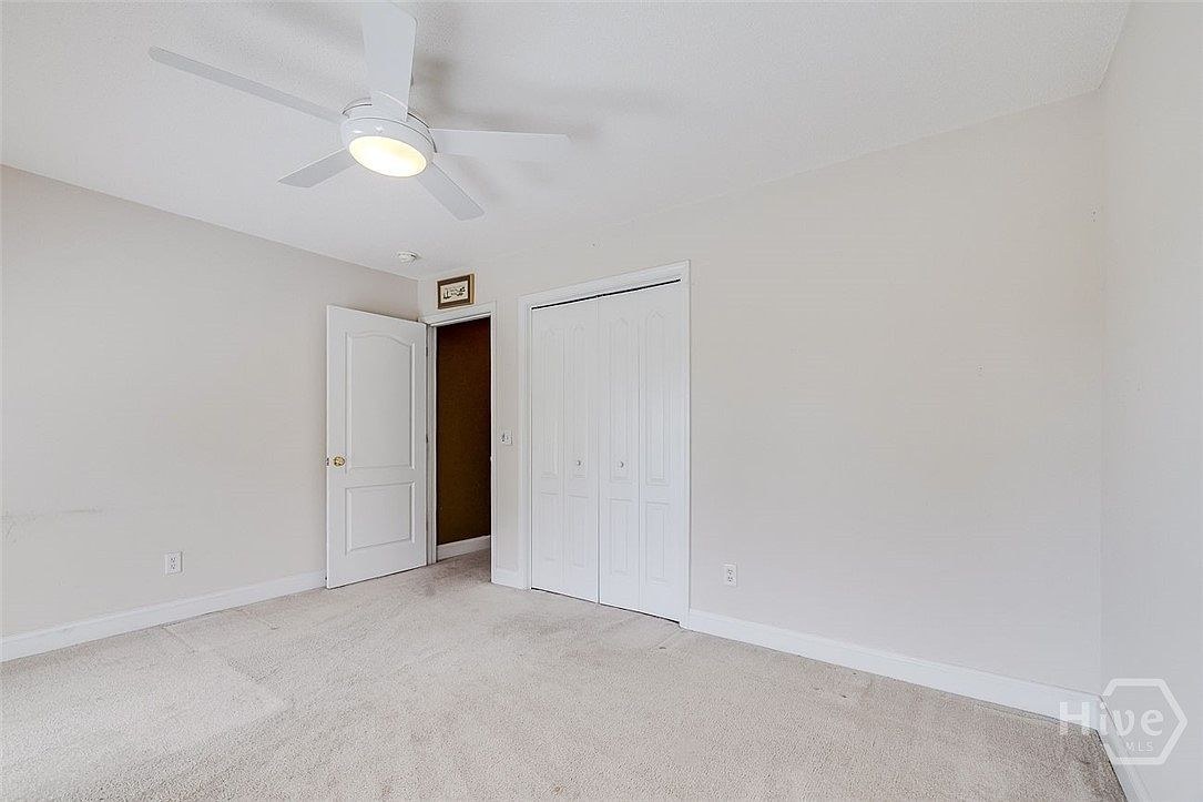 Bedroom with ceiling fan at 641 Marshview Dr.